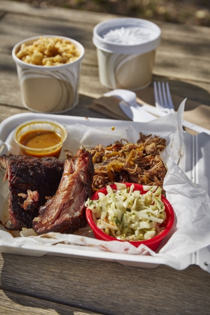 A bbq platter with ribs and coleslaw