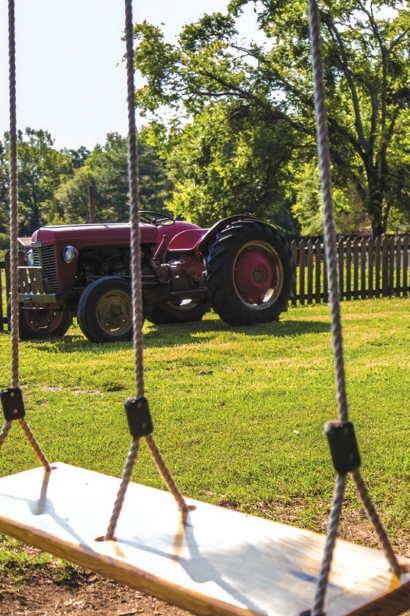 Swing and farm tractor - an idyllic country farm setting
