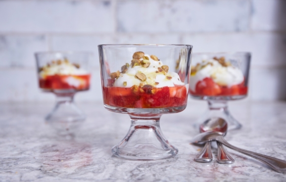 three strawberry parfaits in glass cups