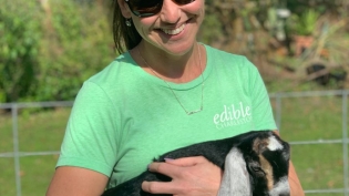 Jacquelyn McHugh, Editor, holding baby goat
